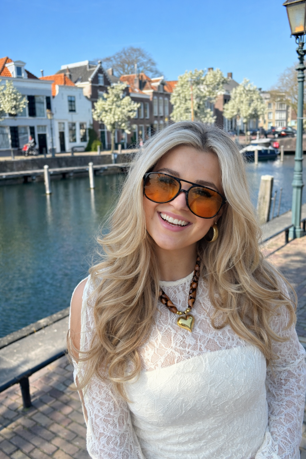 Sunglasses, black frame with orange lenses, plastic, Women's