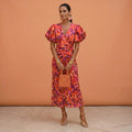 Kelsey | Women's V-Neckline Dress with Puffed Sleeves, Elegant Day Dress | The Shrader Sisters | Naranja/Violeta