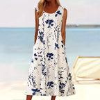 Tegan | Women's Sleeveless A-Line Midi Dress, Floral Print Midi Dress | The Shrader Sisters | Blauw